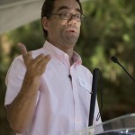 Dmitri Belser speaking at the podium.