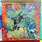 One panel of the Disability Mural. Three wheelchair users going through the woods