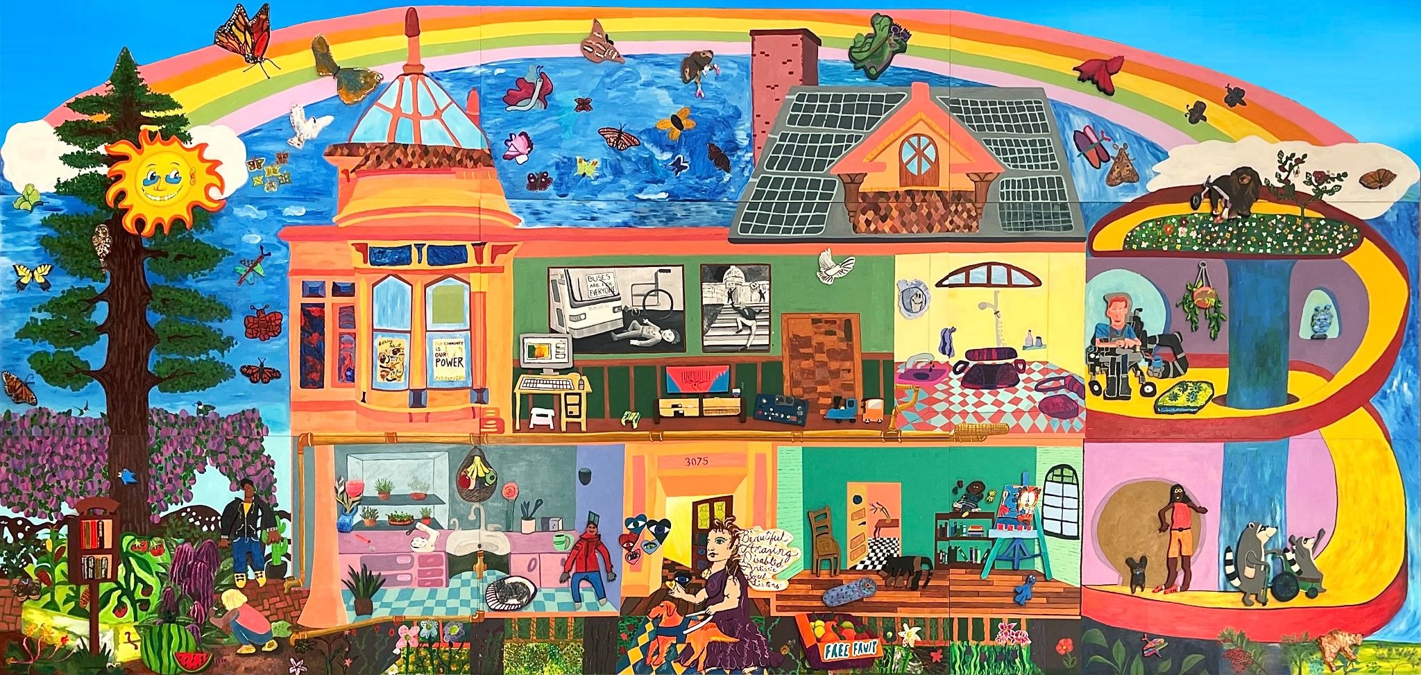 A photograph of a bright and colorful mural with saturated colors and vibrant imagery. The mural depicts a gray water fed garden and a two story house with the facade removed allowing you, the viewer, into most of the intimate interior spaces. Some elements of accessible design are a large yellow and red ramp reminiscent of the helix ramp at ERC and low counters, a splash-friendly bathroom, dimmable lights, swivel spoons, and more.